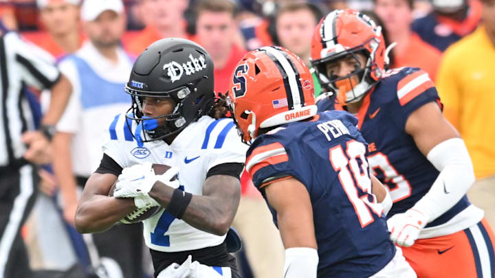 Sep 27, 2025; Syracuse, New York, USA; Duke Blue Devils wide receiver Que'Sean Brown (7) runs against Syracuse Orange defensive back Cornell Perry (19) in the first quarter at the JMA Wireless Dome. Mandatory Credit: Mark Konezny-Imagn Images Sep 27, 2025; Syracuse, New York, USA; Duke Blue Devils wide receiver Que'Sean Brown (7) runs against Syracuse Orange defensive back Cornell Perry (19) in the first quarter at the JMA Wireless Dome. Mandatory Credit: Mark Konezny-Imagn Images