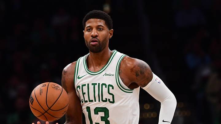 Boston Celtics forward Paul George (13) controls the ball during the first half against the Charlotte Hornets at TD Garden on Oct. 14, 2026.