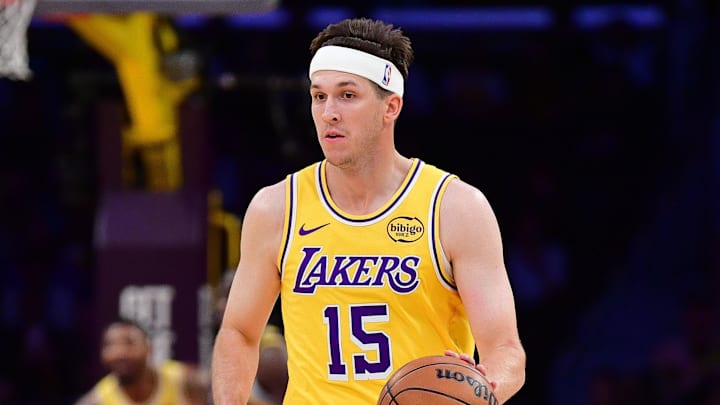 Feb 7, 2026; Los Angeles, California, USA; Los Angeles Lakers guard Austin Reaves (15) moves the ball up court against the Golden State Warriors during the first half at Crypto.com Arena. 