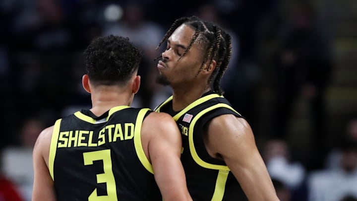Jan 12, 2025; University Park, Pennsylvania, USA; Oregon Ducks guard Keeshawn Barthelemy (9) celebrates with guard Jackson Shelstad (3) after making a three-point basket during the first half against the Penn State Nittany Lions at Bryce Jordan Center. Oregon defeated Penn State 82-81. Mandatory Credit: Matthew O'Haren-Imagn Images Jan 12, 2025; University Park, Pennsylvania, USA; Oregon Ducks guard Keeshawn Barthelemy (9) celebrates with guard Jackson Shelstad (3) after making a three-point basket during the first half against the Penn State Nittany Lions at Bryce Jordan Center. Oregon defeated Penn State 82-81. Mandatory Credit: Matthew O'Haren-Imagn Images