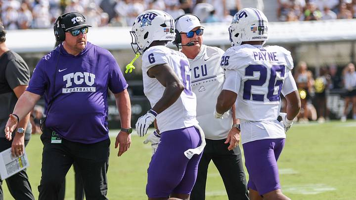 TCU players and coaches gather on the sideline during the Horned Frogs’ Big 12 road matchup against UCF in Orlando.