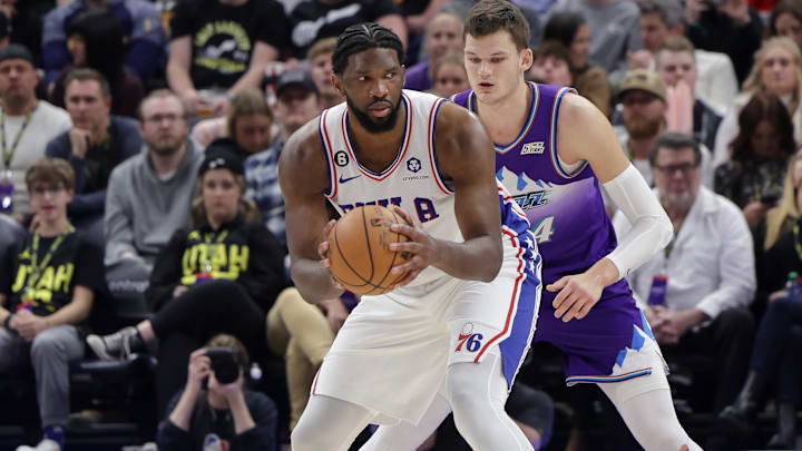 Jan 14, 2023; Salt Lake City, Utah, USA;  Philadelphia 76ers center Joel Embiid (21) keeps the ball away from Utah Jazz center Walker Kessler (24) during the second half at Vivint Arena. Mandatory Credit: Chris Nicoll-Imagn Images