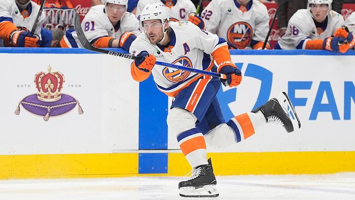 Oct 17, 2026; Toronto, Ontario, CAN;  New York Islanders defenseman Ryan Pulock (6) shoots the puck against the Toronto Maple Leafs during the second period at Scotiabank Arena.  Mandatory Credit: John E. Sokolowski-Imagn Images