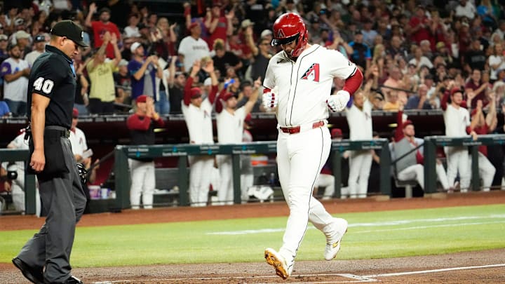 Arizona Diamondbacks Christian Walker (53) scores on a Lourdes Gurriel Jr. RBI-single against the San Francisco Giants in the second inning at Chase Field in Phoenix on Sept. 25, 2024. Arizona Diamondbacks Christian Walker (53) scores on a Lourdes Gurriel Jr. RBI-single against the San Francisco Giants in the second inning at Chase Field in Phoenix on Sept. 25, 2024.