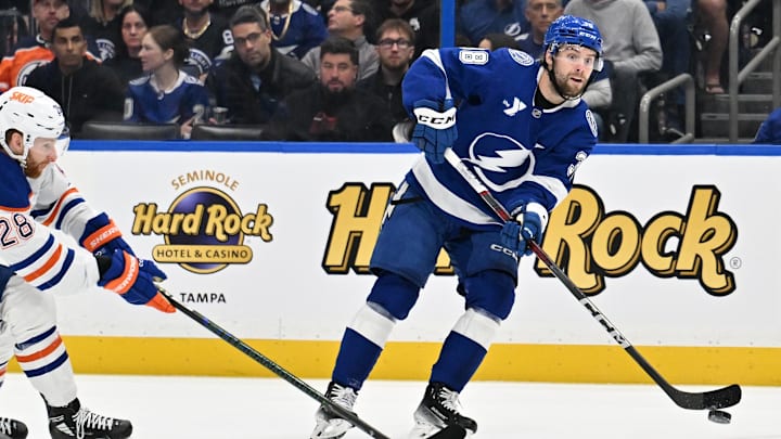 Feb 25, 2025; Tampa, Florida, USA ; Tampa Bay Lightning left wing Brandon Hagel (38) passed the puck in the first period against the Edmonton Oilers  at Amalie Arena. Mandatory Credit: Jonathan Dyer-Imagn Images