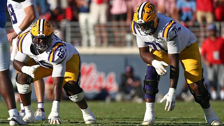Sep 27, 2025; Oxford, Mississippi, USA; LSU Tigers offensive lineman Paul Mubenga (65) and offensive lineman Tyree Adams (71) wait for the snap during the third quarter against the Mississippi Rebels at Vaught-Hemingway Stadium. Mandatory Credit: Petre Thomas-Imagn Images