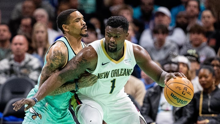 Jan 25, 2025; Charlotte, North Carolina, USA; New Orleans Pelicans forward Zion Williamson (1) controls the ball against Charlotte Hornets guard DaQuan Jeffries (3) during the second quarter at Spectrum Center. Mandatory Credit: Scott Kinser-Imagn Images