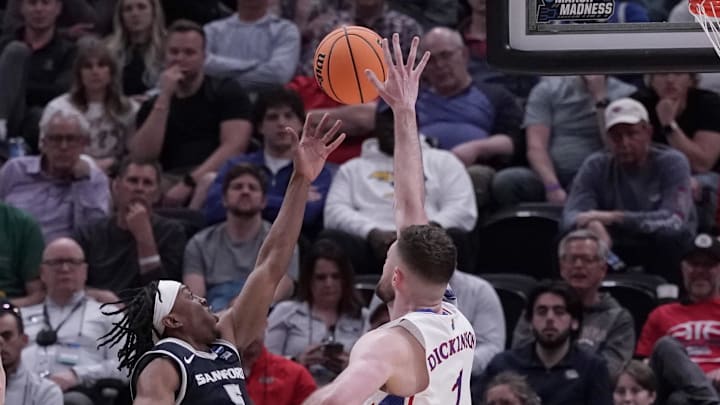 Mar 21, 2024; Salt Lake City, UT, USA; Samford Bulldogs guard A.J. Staton-McCray (5) shoots against Kansas Jayhawks center Hunter Dickinson (1) during the second half in the first round of the 2024 NCAA Tournament at Vivint Smart Home Arena-Delta Center. Mandatory Credit: Gabriel Mayberry-Imagn Images