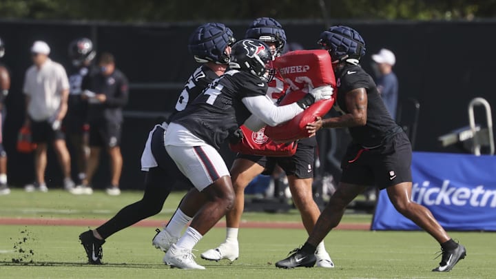 Jul 24, 2025; Houston, TX, USA; Houston Texans tight end Dalton Schultz (86) and tackle Cam Robinson (74) and tight end Brevin Jordan (9) during training camp at Houston Methodist Training Center. Mandatory Credit: Troy Taormina-Imagn Images