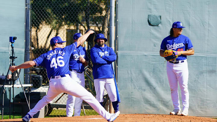Feb 9, 2024; Glendale, AZ, USA; Los Angeles Dodgers pitcher Brusdar Graterol (48) (far right) pauses for a moment during his practice sessions at Camelback Ranch for Spring Training Workouts. Mandatory Credit: Allan Henry-Imagn Images