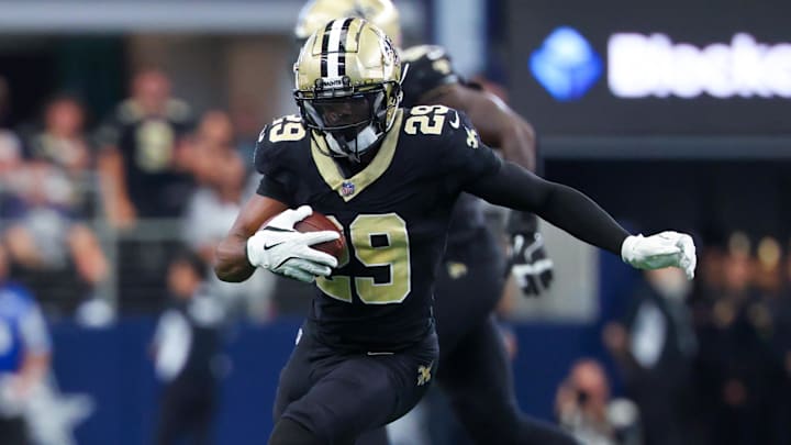Sep 15, 2024; Arlington, Texas, USA;  New Orleans Saints cornerback Paulson Adebo (29) intercepts a ball intended for Dallas Cowboys wide receiver Jalen Brooks (not pictured) during the first half at AT&T Stadium. Mandatory Credit: Kevin Jairaj-Imagn Images