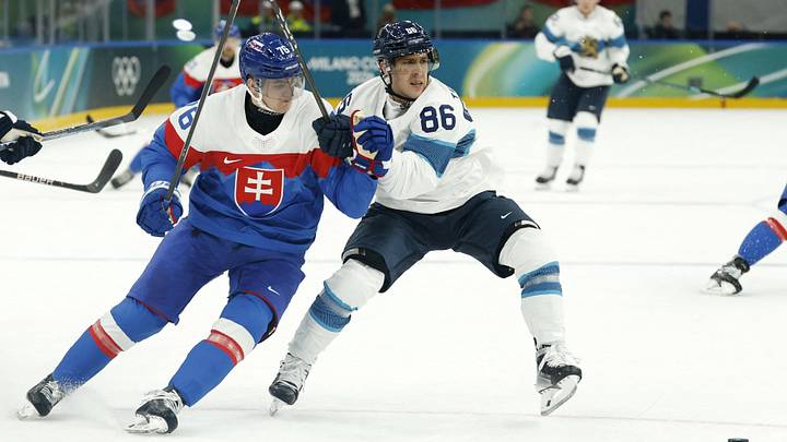 Feb 11, 2026; Milan, Italy; Martin Pospisil of Slovakia in action with Teuvo Teravainen of Finland in men's ice hockey group B play during the Milano Cortina 2026 Olympic Winter Games at Milano Santagiulia Ice Hockey Arena. Mandatory Credit: Geoff Burke-Imagn Images Feb 11, 2026; Milan, Italy; Martin Pospisil of Slovakia in action with Teuvo Teravainen of Finland in men's ice hockey group B play during the Milano Cortina 2026 Olympic Winter Games at Milano Santagiulia Ice Hockey Arena. Mandatory Credit: Geoff Burke-Imagn Images