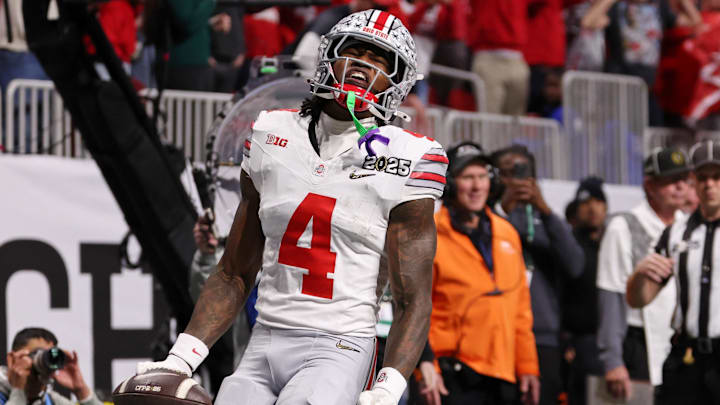 Jan 20, 2025; Atlanta, GA, USA; Ohio State Buckeyes wide receiver Jeremiah Smith (4) reacts after scoring against the Notre Dame Fighting Irish a touchdown during the first half the CFP National Championship college football game at Mercedes-Benz Stadium. Mandatory Credit: Brett Davis-Imagn Images