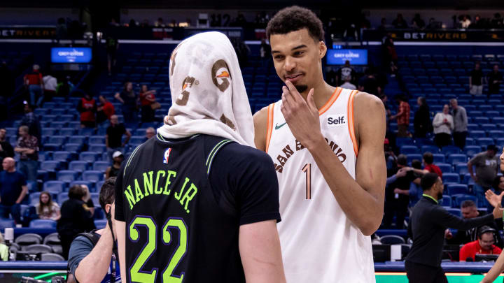 Apr 5, 2024; New Orleans, Louisiana, USA; San Antonio Spurs center Victor Wembanyama (1) talks to New Orleans Pelicans forward Larry Nance Jr. (22) after the game  at Smoothie King Center. 