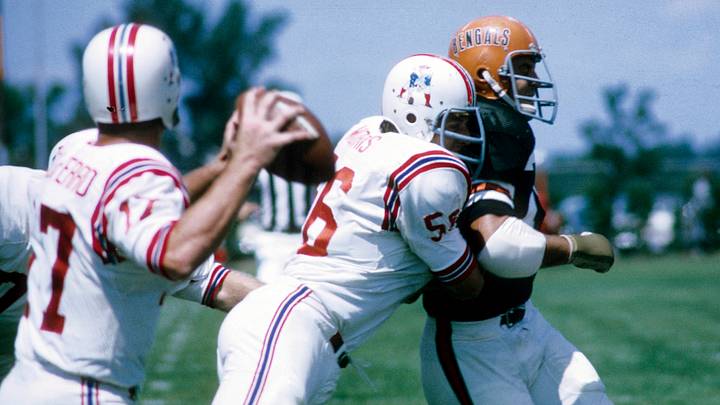 Aug 10, 1969; Bowling Green, OH, USA; FILE PHOTO; Boston Patriots center Jon Morris (56) blocks for quarterback Mike Taliaferro (17) during a 1969 pre-season game against the Cincinnati Bengals at Doyt Perry Stadium. Mandatory Credit: Dick Raphael-USA TODAY Sports