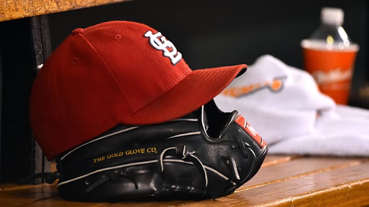 Aug 15, 2015; St. Louis, MO, USA; A detailed view of a baseball glove and St. Louis Cardinals hat in the dugout during the game between the Cardinals and the Miami Marlins at Busch Stadium. Mandatory Credit: Jasen Vinlove-Imagn Images Aug 15, 2015; St. Louis, MO, USA; A detailed view of a baseball glove and St. Louis Cardinals hat in the dugout during the game between the Cardinals and the Miami Marlins at Busch Stadium. Mandatory Credit: Jasen Vinlove-Imagn Images