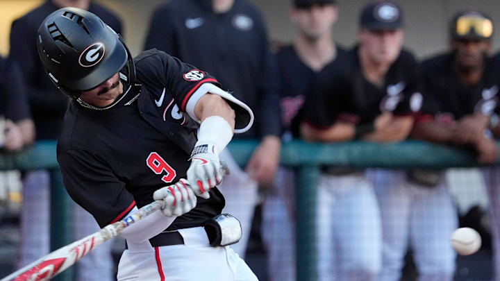 Georgia infielder Kolby Branch (9) swings to hit a homer during a NCAA baseball game against Arkansas in Athens, Ga., on Friday, April 11, 2025.