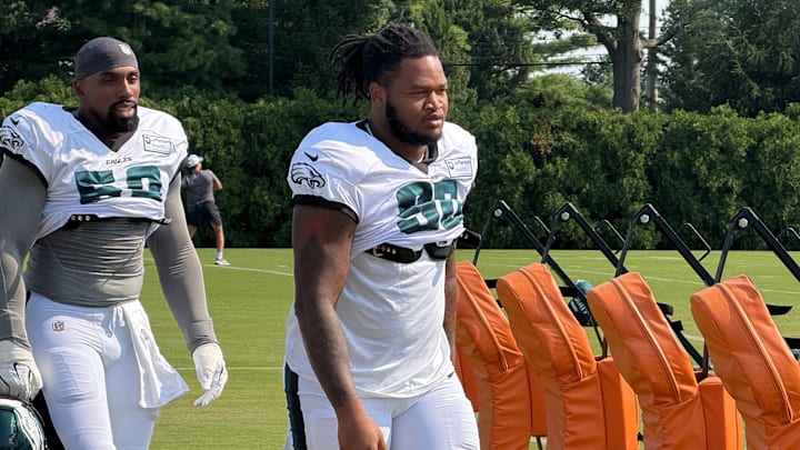 Eagles defensive linemen Thomas Booker (left) and Jalen Carter take the field for Day 9 of training camp.