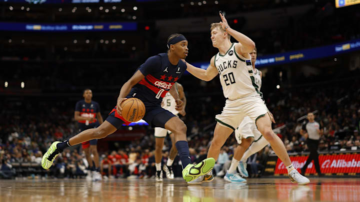 Feb 21, 2025; Washington, District of Columbia, USA; Washington Wizards guard Bilal Coulibaly (0) drives to the basket as Milwaukee Bucks guard AJ Green (20) defends in the second half at Capital One Arena. Mandatory Credit: Geoff Burke-Imagn Images
