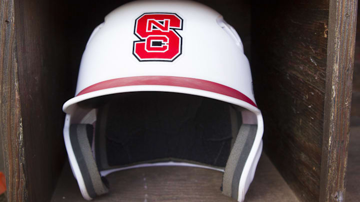 Jun 8, 2013; Raleigh, NC, USA; A North Carolina State Wolfpack helmet lays in the dugout prior to the game against the Rice Owls in the Raleigh super regional of the 2013 NCAA baseball tournament at Doak Field. Mandatory Credit: Jeremy Brevard-Imagn Images