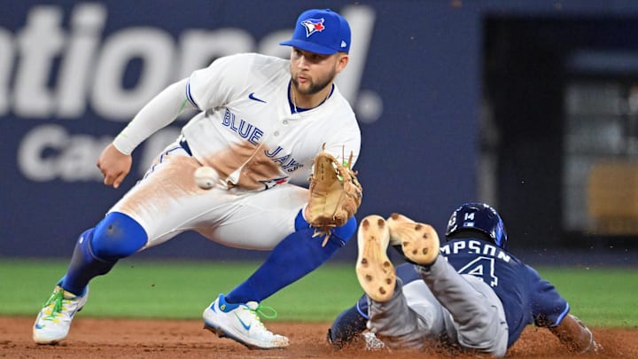 Toronto Blue Jays shortstop Bo Bichette (11) tags out Tampa Bay Rays left fielder Chandler Simpson at second base on a steal attempt. Toronto Blue Jays shortstop Bo Bichette (11) tags out Tampa Bay Rays left fielder Chandler Simpson at second base on a steal attempt.