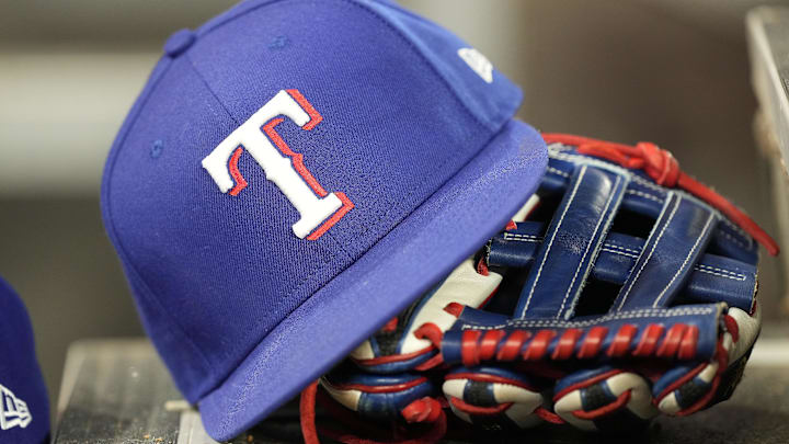 A hat and glove of a Texas Rangers player during a game against the Toronto Blue Jays at Rogers Centre. 