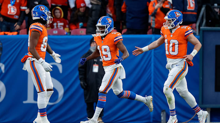 Jan 5, 2025; Denver, Colorado, USA; Denver Broncos wide receiver Marvin Mims Jr. (19) celebrates his touchdown with wide receiver Lil'Jordan Humphrey (84) and quarterback Bo Nix (10) in the third quarter against the Kansas City Chiefs at Empower Field at Mile High. Mandatory Credit: Isaiah J. Downing-Imagn Images