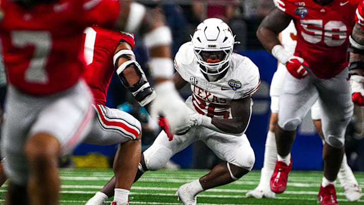 Texas Longhorns running back Quintrevion Wisner (26) runs the ball during the College Football Playoff semifinal game against Ohio State in the Cotton Bowl at AT&T Stadium on Friday, Jan. 10, 2024 in Arlington, Texas. Texas Longhorns running back Quintrevion Wisner (26) runs the ball during the College Football Playoff semifinal game against Ohio State in the Cotton Bowl at AT&T Stadium on Friday, Jan. 10, 2024 in Arlington, Texas.