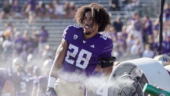 Sam Adams cools off on UW sideline during a game. 