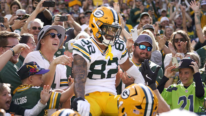 Green Bay Packers wide receiver Will Sheppard (82) jumps into the crowd for a Lambeau Leap after scoring a touchdown vs. the Seattle Seahawks.
