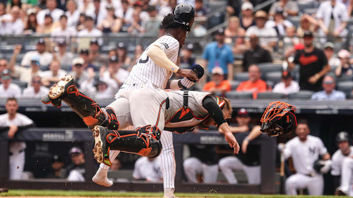 New York Yankees second baseman Jazz Chisholm Jr. collides with Baltimore Orioles catcher Maverick Handley