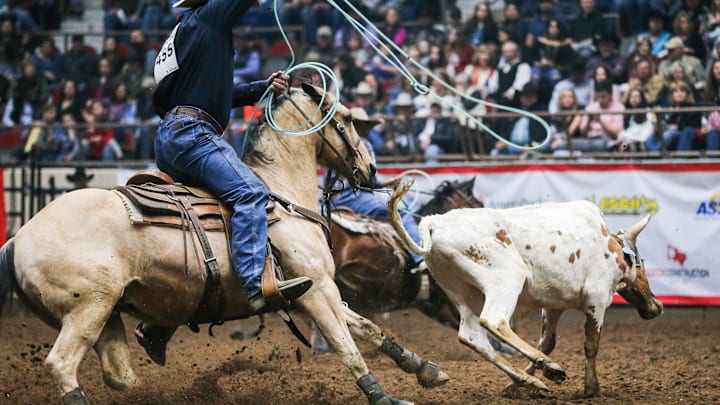 Aaron Tsinigine and Kyle Lockett team rope during the 3rd performance of the San Angelo Stock Show Rodeo