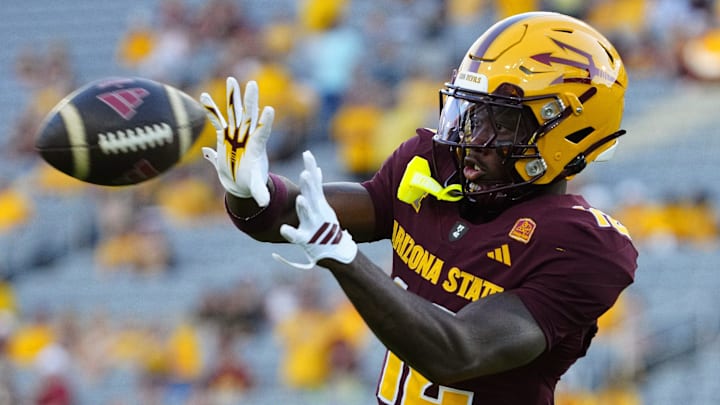 Arizona State wide receiver Malik McClain (12) catches a pass in warm ups during a game at Mountain America Stadium in Tempe, Arizona, on Aug. 30, 2025. Arizona State wide receiver Malik McClain (12) catches a pass in warm ups during a game at Mountain America Stadium in Tempe, Arizona, on Aug. 30, 2025.