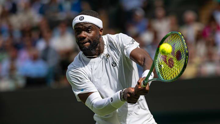 Frances Tiafoe debuts lululemon's all-white kit at Wimbledon.