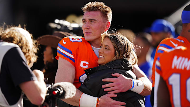 Denver Broncos quarterback Bo Nix (10) hugs wife, Izzy Nix before the game against the Los Angeles Chargers at Empower Field at Mile High. 
