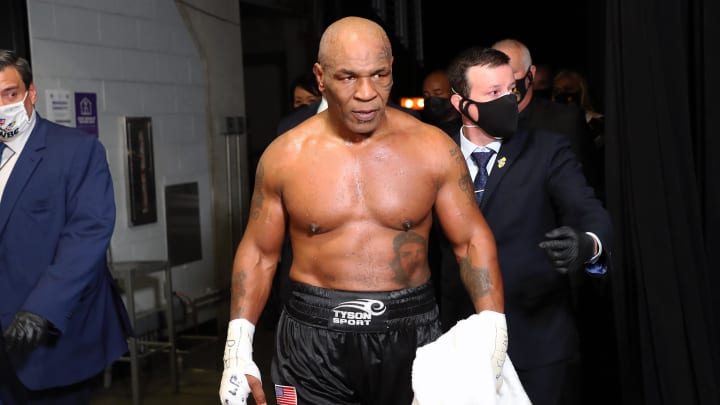 Nov 28, 2020; Los Angeles, CA, USA; Mike Tyson (black trunks) exits the ring after his split draw against Roy Jones, Jr. (white trunks) during a heavyweight exhibition boxing bout for the WBC Frontline Belt at the Staples Center. Mandatory Credit: Joe Scarnici/Handout Photo via USA TODAY Sports Nov 28, 2020; Los Angeles, CA, USA; Mike Tyson (black trunks) exits the ring after his split draw against Roy Jones, Jr. (white trunks) during a heavyweight exhibition boxing bout for the WBC Frontline Belt at the Staples Center. Mandatory Credit: Joe Scarnici/Handout Photo via USA TODAY Sports