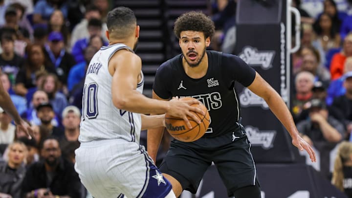 Dec 29, 2024; Orlando, Florida, USA; Brooklyn Nets forward Cameron Johnson (2) defends Orlando Magic guard Cory Joseph (10) during the second quarter at Kia Center. Mandatory Credit: Mike Watters-Imagn Images