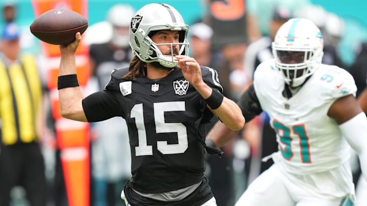 Las Vegas Raiders quarterback Gardner Minshew (15) drops back to pass against the Miami Dolphins in the first quarter at Hard Rock Stadium. Las Vegas Raiders quarterback Gardner Minshew (15) drops back to pass against the Miami Dolphins in the first quarter at Hard Rock Stadium.