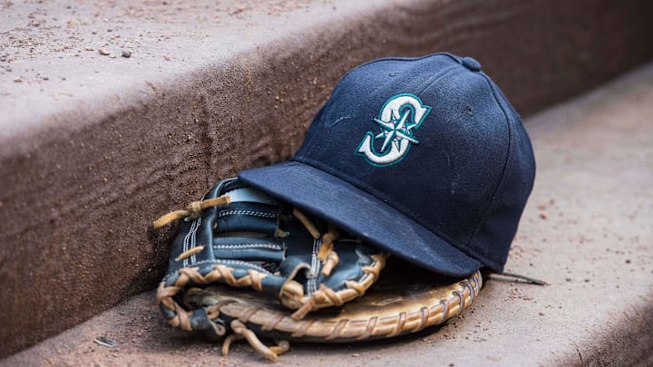 Aug 18, 2015; Arlington, TX, USA; A view of a Seattle Mariners ball cap and glove during the game between the Texas Rangers and the Seattle Mariners at Globe Life Park in Arlington. The Mariners defeat the Rangers 3-2. Mandatory Credit: Jerome Miron-Imagn Images