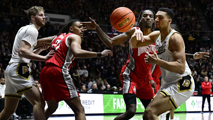 Purdue forward Trey Kaufman-Renn loses control of the ball in front of Ohio State forward Aaron Bradshaw