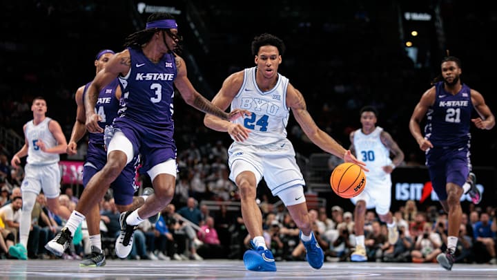 Mar 10, 2026; Kansas City, MO, USA; BYU Cougars forward Dominique Diomande (24) brings the ball up court around Kansas State Wildcats guard C.J. Jones (3) during the first half at T-Mobile Center. Mandatory Credit: William Purnell-Imagn Images