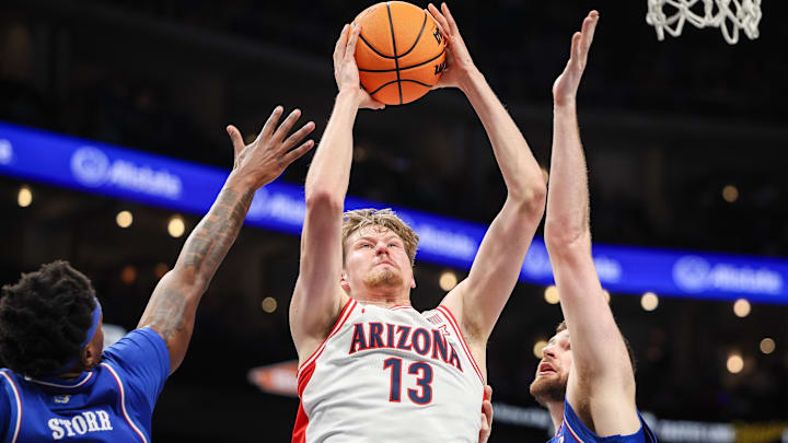 Arizona Wildcats forward Henri Veesaar (13) rebounds during the first half against the Kansas Jayhawks at T-Mobile Center. 