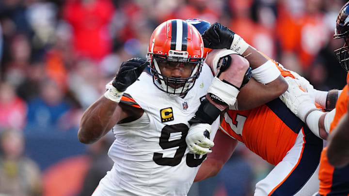 Nov 26, 2023; Denver, Colorado, USA; Cleveland Browns defensive end Myles Garrett (95) rushes past Denver Broncos offensive tackle Garett Bolles (72) in the first half at Empower Field at Mile High. Mandatory Credit: Ron Chenoy-Imagn Images