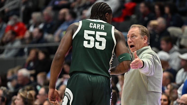 Oct 28, 2025; Hartford, CT, USA; Michigan State Spartans head coach Tom Izzo talks with Michigan State Spartans forward Coen Carr (55) during the first half against the Connecticut Huskies at PeoplesBank Arena. Mandatory Credit: Mark Smith-Imagn Images