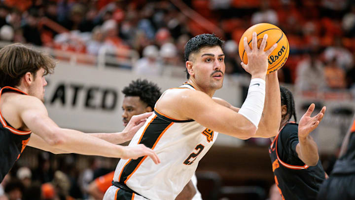 Dec 2, 2025; Stillwater, Oklahoma, USA; Oklahoma State Cowboys center Parsa Fallah (22) controls the ball during the first half against the Sam Houston Bearkats at Gallagher-Iba Arena. Mandatory Credit: William Purnell-Imagn Images