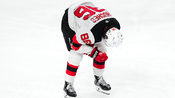 Mar 2, 2025; Las Vegas, Nevada, USA; New Jersey Devils center Jack Hughes (86) makes his way off the ice after sustaining an apparent injury during a play against the Vegas Golden Knights during the third period at T-Mobile Arena. Mandatory Credit: Stephen R. Sylvanie-Imagn Images