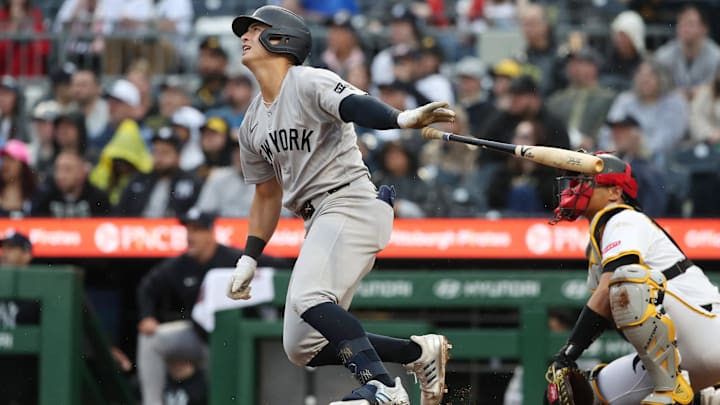 Apr 5, 2025; Pittsburgh, Pennsylvania, USA;  New York Yankees shortstop Anthony Volpe (11) hits a three run double against the Pittsburgh Pirates during the fifth inning  at PNC Park.