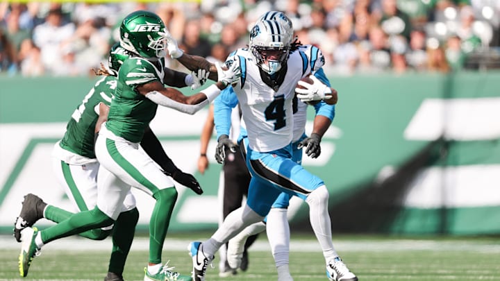 Oct 19, 2025; East Rutherford, New Jersey, USA; Carolina Panthers wide receiver Tetairoa McMillan (4) stiff arms New York Jets cornerback Sauce Gardner (1) in the second quarter at MetLife Stadium. Mandatory Credit: Vincent Carchietta-Imagn Images Oct 19, 2025; East Rutherford, New Jersey, USA; Carolina Panthers wide receiver Tetairoa McMillan (4) stiff arms New York Jets cornerback Sauce Gardner (1) in the second quarter at MetLife Stadium. Mandatory Credit: Vincent Carchietta-Imagn Images