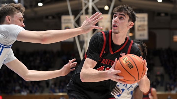 Feb 15, 2025; Durham, North Carolina, USA;  Stanford Cardinal forward Maxime Raynaud (42) drives towards the basket against Duke Blue Devils forward Cooper Flagg (2) at Cameron Indoor Stadium. Mandatory Credit: Zachary Taft-Imagn Images