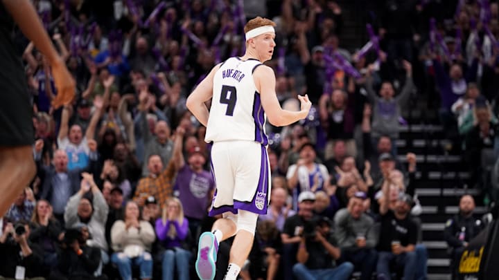 Nov 13, 2023; Sacramento, California, USA; Sacramento Kings guard Kevin Huerter (9) reacts after making a three-point basket against the Cleveland Cavaliers in the third quarter at the Golden 1 Center. Mandatory Credit: Cary Edmondson-Imagn Images